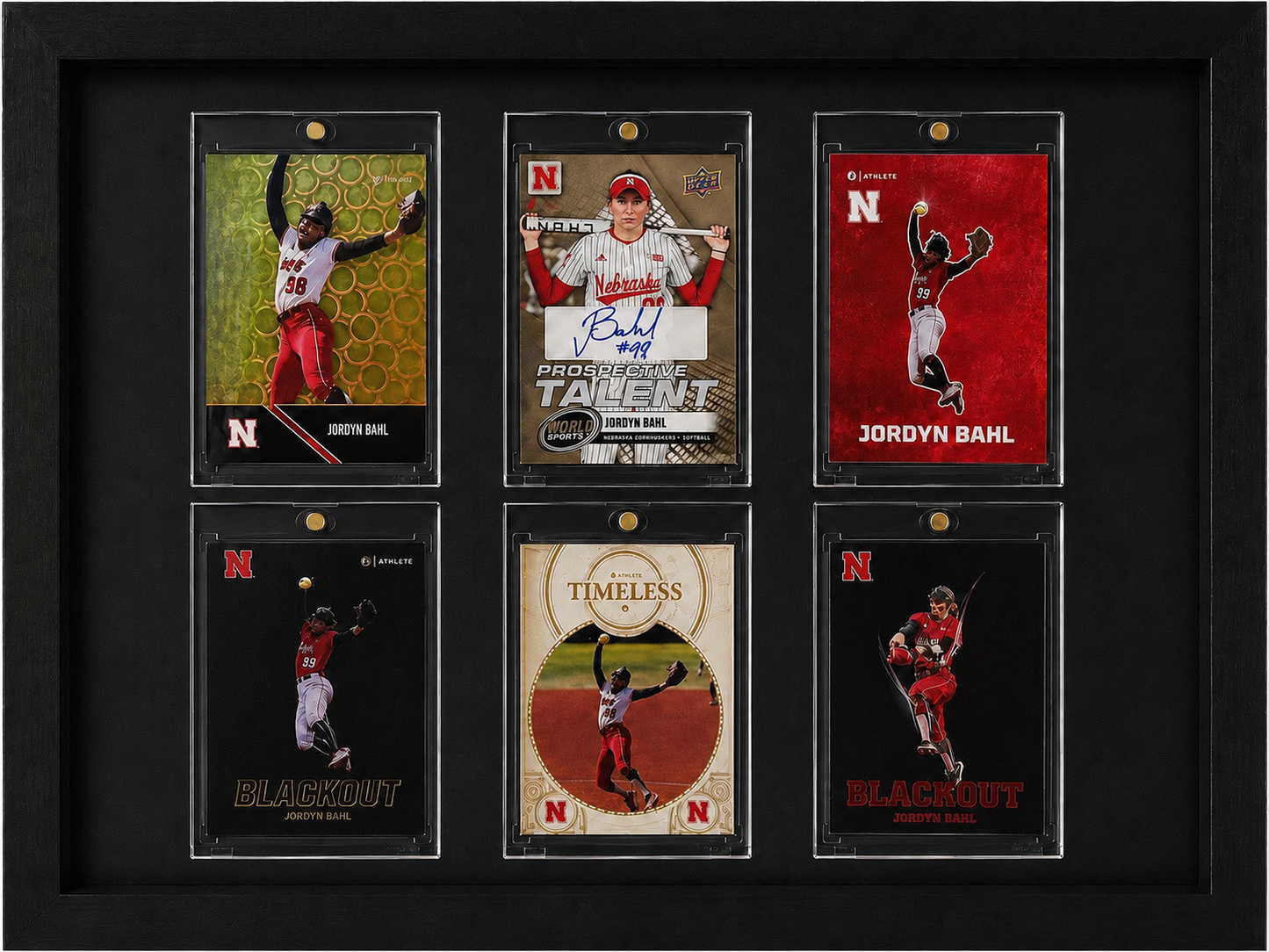 Framed collection of sports trading cards featuring athletes with Nebraska branding.